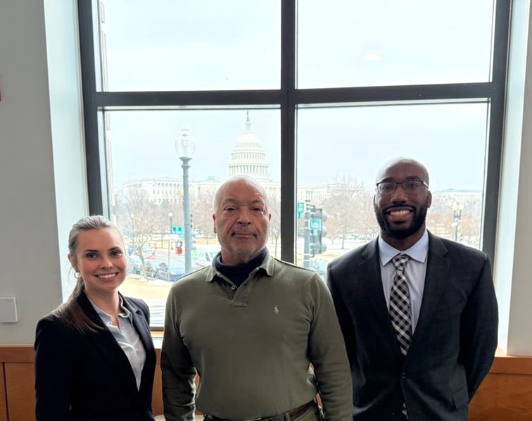 two students and judge gordon posing