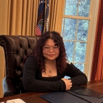Person sitting in leather chair
