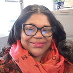 Shannan Taylor smiling and wearing a scarf