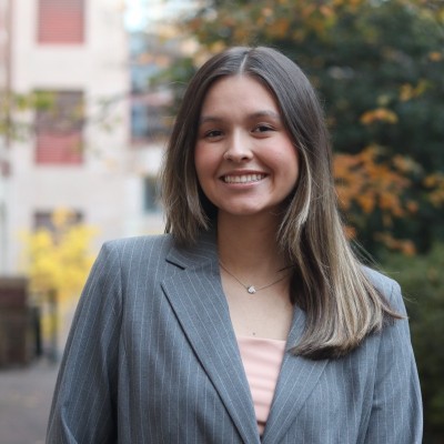 Headshot taken outdoors with subject dressed in business attire