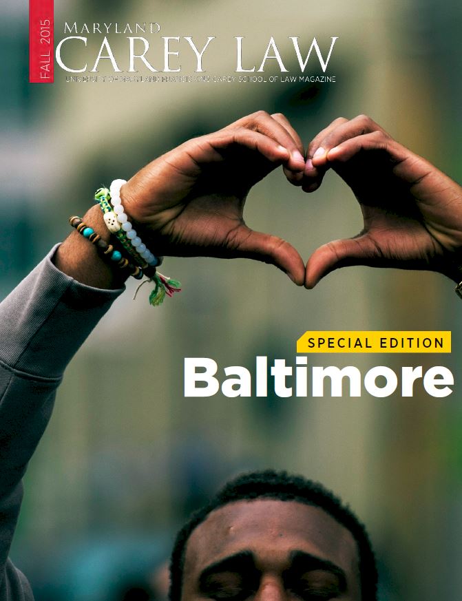 fall 2025 image of man with hands making a heart gesture